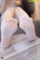 A pair of white socks sitting on top of a table.